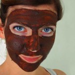 Low carb chocolate coffee face mask on young woman.